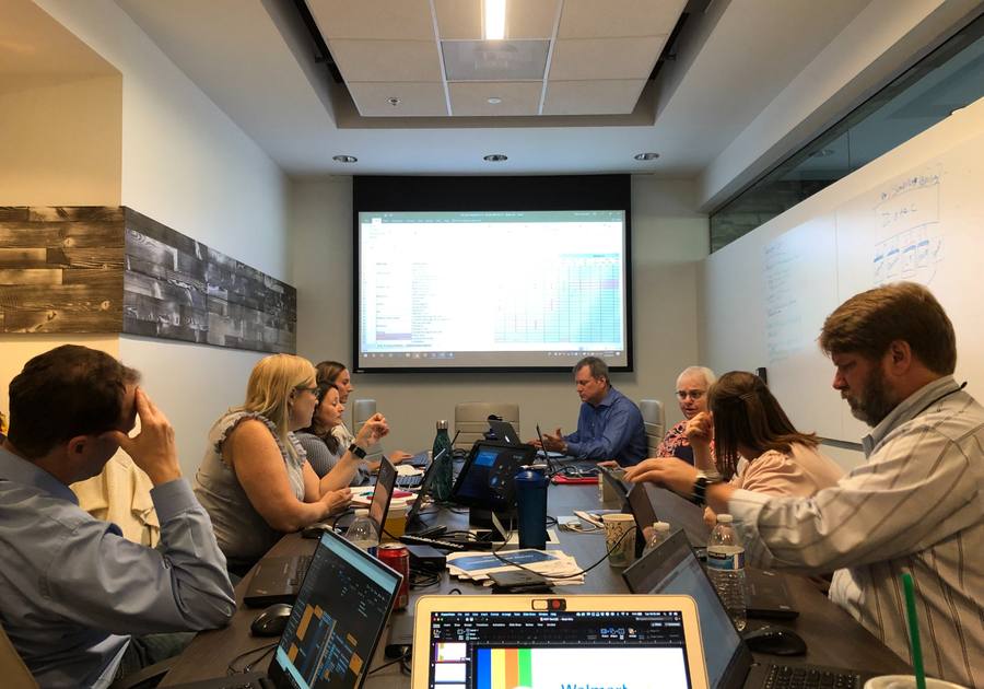 Executives reviewing strategy materials together